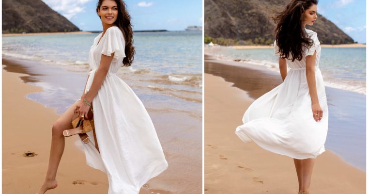 Biała sukienka maxi na modelce w stylizacji na plażę. W tle może, plaża i niebo.